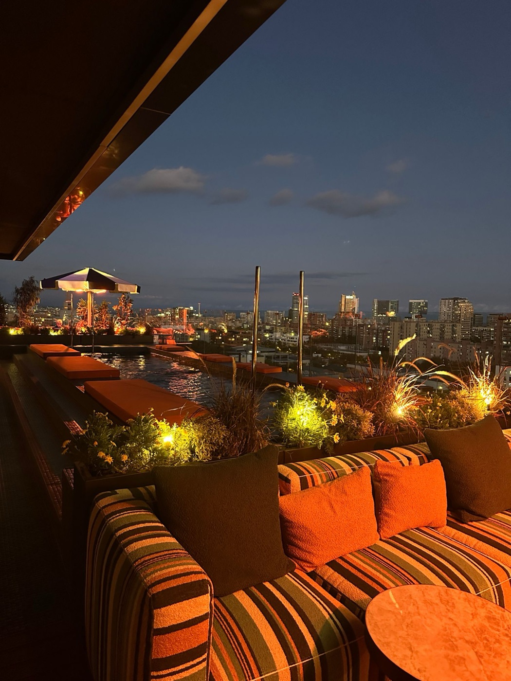 Behind the scenes: rooftop pool lounge at dusk