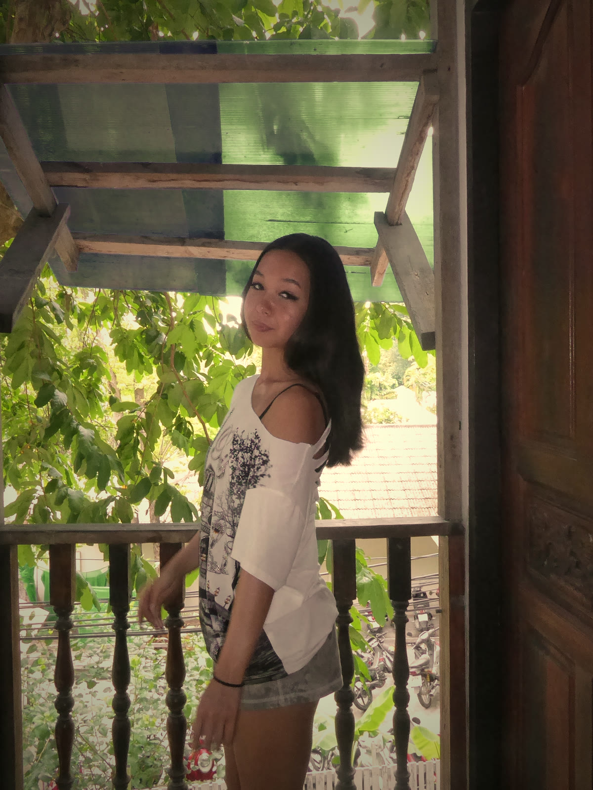 Founder on a balcony surrounded by greenery