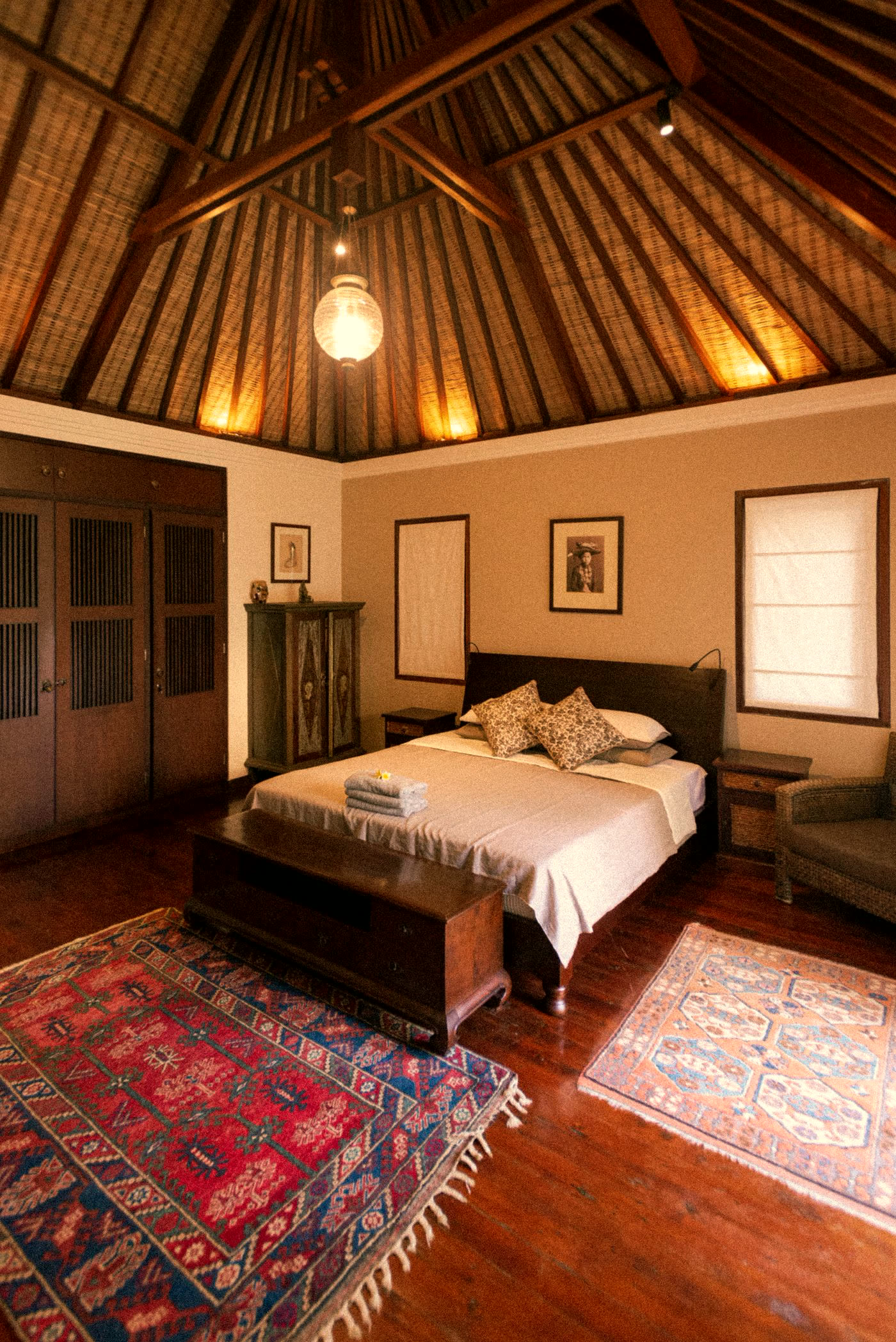 Balinese villa bedroom with traditional timber decor