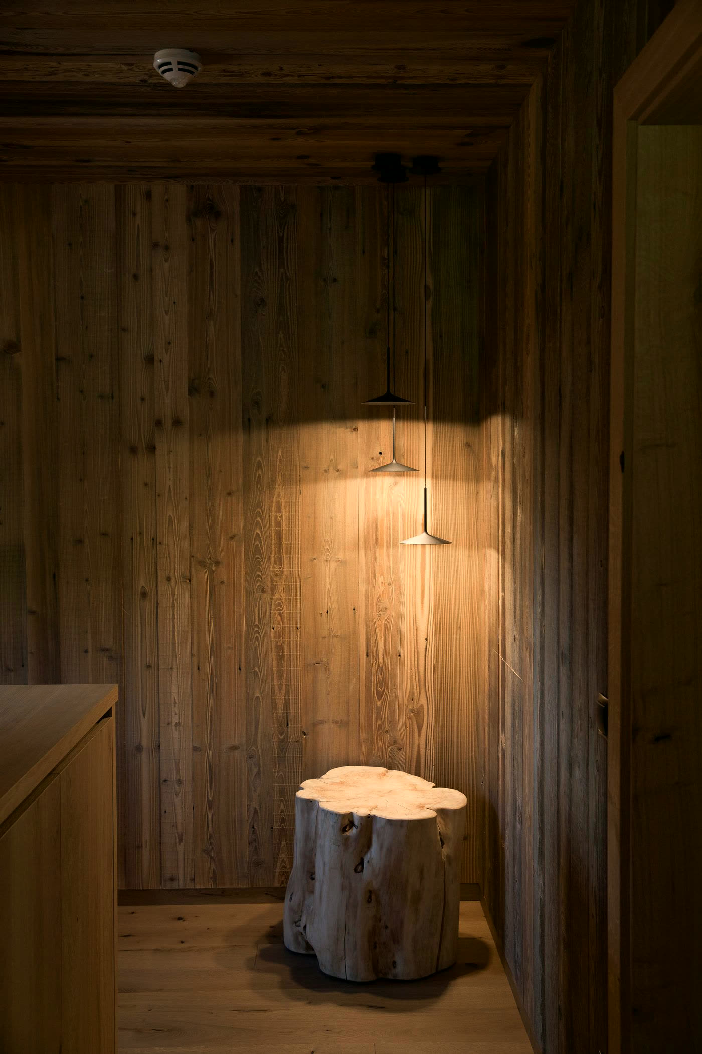 Warm timber interior with rustic decor and low light